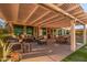 Relaxing patio area with covered pergola, comfortable seating, and dining at 14316 W Circle Ridge Dr, Sun City West, AZ 85375