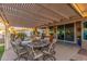 Covered patio with a mosaic tile table and seating at 14316 W Circle Ridge Dr, Sun City West, AZ 85375