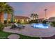 Relaxing pool area with lounge chairs and a beautiful sunset view at 14316 W Circle Ridge Dr, Sun City West, AZ 85375