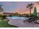 Freeform pool and patio with lounge chairs, offering a relaxing outdoor space at 14316 W Circle Ridge Dr, Sun City West, AZ 85375