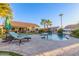 Relaxing pool area with lounge chairs and a view of the house at 14316 W Circle Ridge Dr, Sun City West, AZ 85375