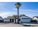 Single story home with a white exterior and a two-car garage at 1437 W Ross Ave, Phoenix, AZ 85027