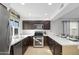 L-shaped kitchen with stainless steel appliances and white countertops at 1437 W Ross Ave, Phoenix, AZ 85027