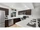 L-shaped kitchen with stainless steel appliances and white countertops at 1437 W Ross Ave, Phoenix, AZ 85027