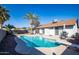 Inviting backyard oasis with a pool and diving board at 1437 W Ross Ave, Phoenix, AZ 85027