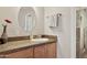 Well-lit bathroom with granite vanity and a large mirror at 15212 N Palmetto Ln, Fountain Hills, AZ 85268