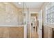 Bathroom with a large walk-in shower and tiled walls at 15212 N Palmetto Ln, Fountain Hills, AZ 85268