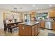 Eat-in kitchen with an island, stainless steel appliances, and wood cabinets at 15212 N Palmetto Ln, Fountain Hills, AZ 85268