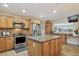 Modern kitchen with granite countertops, stainless steel appliances, and an island at 15212 N Palmetto Ln, Fountain Hills, AZ 85268