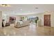 Spacious living room with large windows, tile floors and a neutral color scheme at 15212 N Palmetto Ln, Fountain Hills, AZ 85268