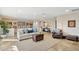 Bright living room featuring a large sofa, gallery wall, and area rug at 15212 N Palmetto Ln, Fountain Hills, AZ 85268