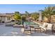 Relaxing pool area with patio furniture and lush landscaping at 15212 N Palmetto Ln, Fountain Hills, AZ 85268