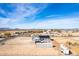 Aerial view of house with storage and RV parking at 1529 S 357Th Ave, Tonopah, AZ 85354