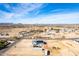 Wide aerial view showing house, neighborhood, and distant mountains at 1529 S 357Th Ave, Tonopah, AZ 85354