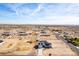 Aerial view of a house, yard, and surrounding desert landscape at 1529 S 357Th Ave, Tonopah, AZ 85354