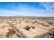 Aerial view of a house with solar panels in a desert community at 1529 S 357Th Ave, Tonopah, AZ 85354