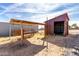 Backyard with various outbuildings and storage at 1529 S 357Th Ave, Tonopah, AZ 85354