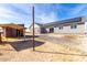 Backyard view with shed, gravel, and additional storage at 1529 S 357Th Ave, Tonopah, AZ 85354