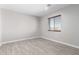 Simple bedroom with wood-look tile floor and window coverings at 1529 S 357Th Ave, Tonopah, AZ 85354