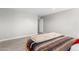 Bedroom with wood-framed bed and tile floors at 1529 S 357Th Ave, Tonopah, AZ 85354