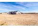 House exterior view showing a gray house and desert landscape at 1529 S 357Th Ave, Tonopah, AZ 85354