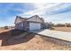 House exterior showcasing a gray house and driveway at 1529 S 357Th Ave, Tonopah, AZ 85354