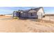 Exterior view of a single-story house with solar panels at 1529 S 357Th Ave, Tonopah, AZ 85354