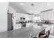 Modern kitchen with white cabinets, gray countertops, and island at 1529 S 357Th Ave, Tonopah, AZ 85354