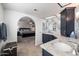 Main bathroom with a large vanity and a view into the bedroom at 1532 Leisure World --, Mesa, AZ 85206