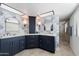 Elegant bathroom with a double vanity and patterned wallpaper at 1532 Leisure World --, Mesa, AZ 85206