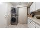 Laundry room with stackable washer and dryer, plus storage at 1532 Leisure World --, Mesa, AZ 85206