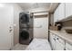 Laundry room with stackable washer and dryer, plus storage at 1532 Leisure World --, Mesa, AZ 85206