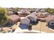 Aerial view of a tan house in a residential neighborhood at 15365 W Caribbean Ln, Surprise, AZ 85379