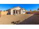 House exterior and spacious backyard at 15365 W Caribbean Ln, Surprise, AZ 85379