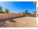 Large backyard with block wall and gravel at 15365 W Caribbean Ln, Surprise, AZ 85379