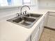 Stainless steel double sink with chrome faucet at 15365 W Caribbean Ln, Surprise, AZ 85379