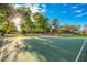 Community basketball court with lush landscaping and mature trees at 163 W Dragon Tree Ave, Queen Creek, AZ 85140