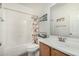 Clean bathroom with shower/tub combo and wood vanity at 163 W Dragon Tree Ave, Queen Creek, AZ 85140