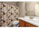 Bathroom featuring decorative curtains, toilet and sink at 163 W Dragon Tree Ave, Queen Creek, AZ 85140