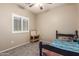 Neutral bedroom with carpet, window and ceiling fan at 163 W Dragon Tree Ave, Queen Creek, AZ 85140