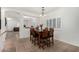 Dining area with wooden table and six chairs at 163 W Dragon Tree Ave, Queen Creek, AZ 85140