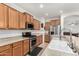 Bright kitchen featuring stainless steel appliances and wood cabinets at 163 W Dragon Tree Ave, Queen Creek, AZ 85140