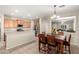 This open concept kitchen overlooks the dining area and has stainless appliances and wood cabinets at 163 W Dragon Tree Ave, Queen Creek, AZ 85140