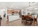 Kitchen with island and view into dining area at 163 W Dragon Tree Ave, Queen Creek, AZ 85140