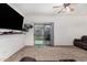 Living room with sliding door access to backyard at 163 W Dragon Tree Ave, Queen Creek, AZ 85140