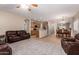 Spacious open-concept living area connected to the kitchen and dining room at 163 W Dragon Tree Ave, Queen Creek, AZ 85140
