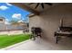 Covered patio with built-in grill and backyard view at 163 W Dragon Tree Ave, Queen Creek, AZ 85140