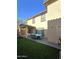 Artificial turf backyard with covered patio and dining area at 16425 W Latham St, Goodyear, AZ 85338