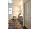 Clean bathroom with double vanity and gray cabinets at 16425 W Latham St, Goodyear, AZ 85338