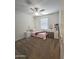 Bedroom with twin bed, vanity and ceiling fan at 16425 W Latham St, Goodyear, AZ 85338